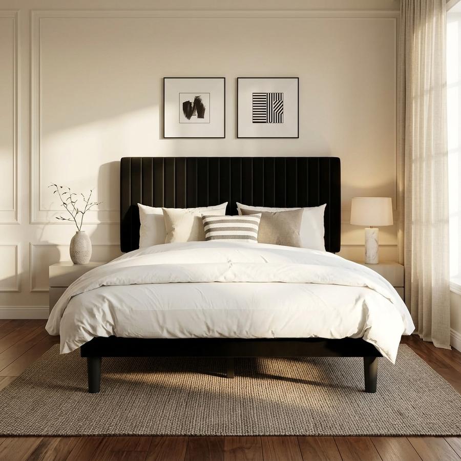 Black velvet adjustable Queen bed frame in a modern bedroom, soft lighting